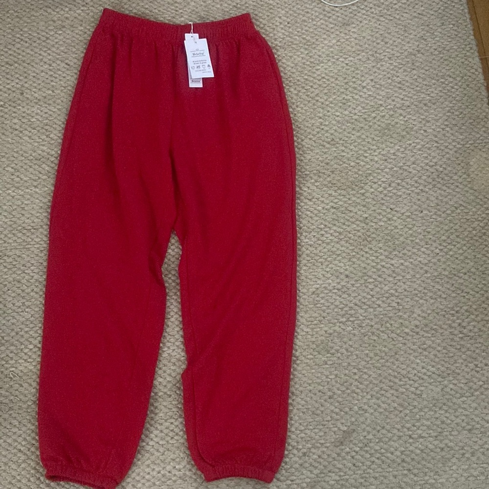 red sweatpants, brand new with tags, size XL